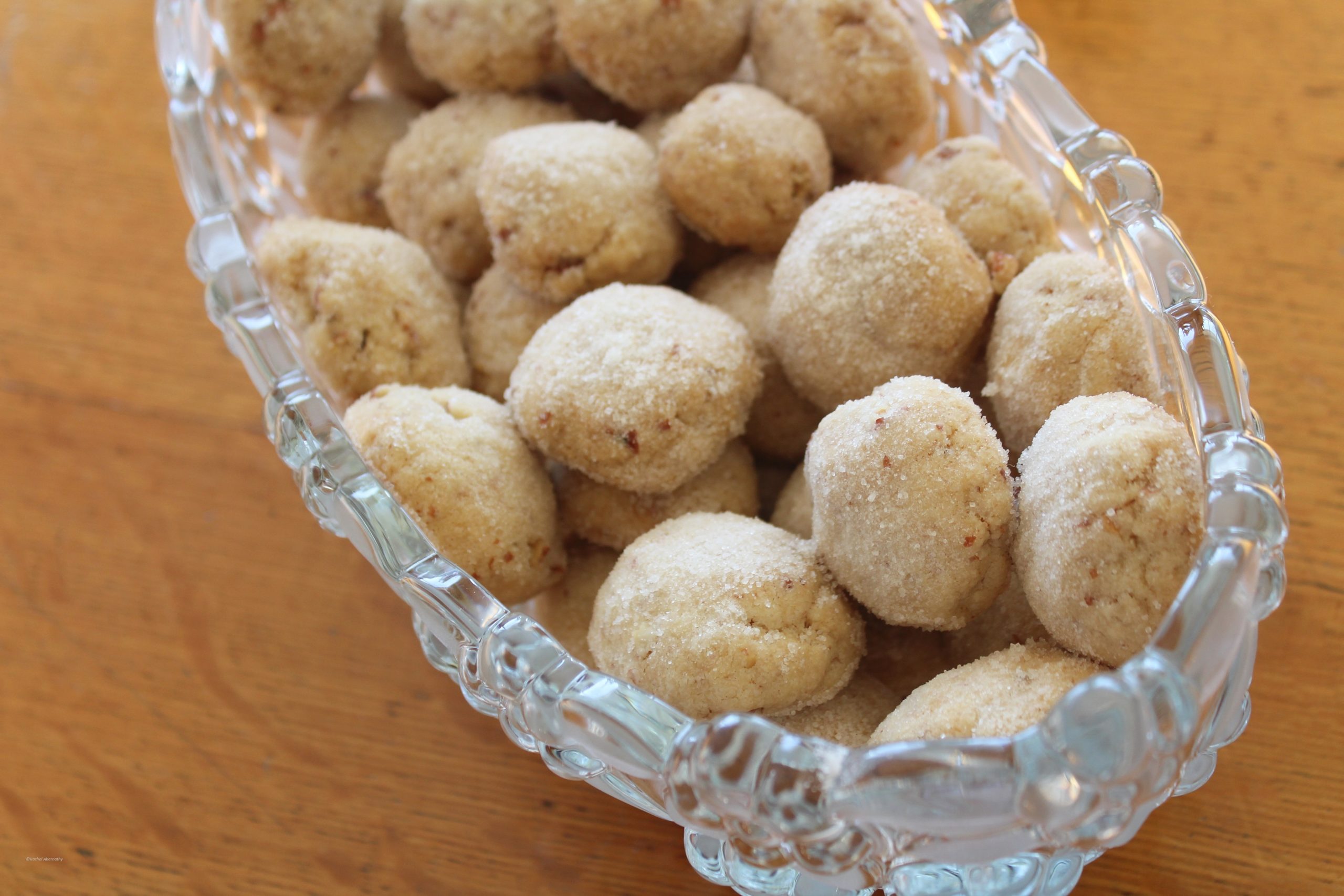 Pecan Sandies in a pretty glass serving bowl.