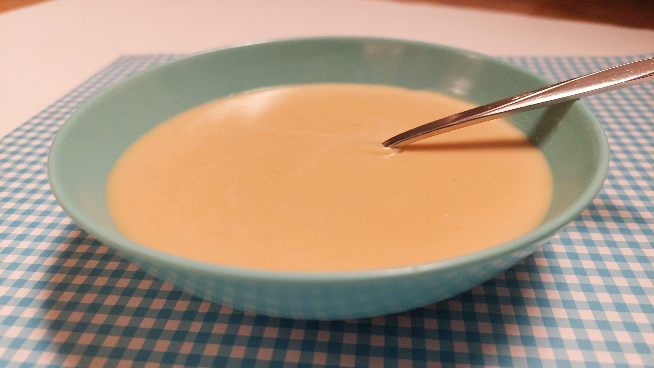 Bowl filled with yummy homemade vanilla pudding.